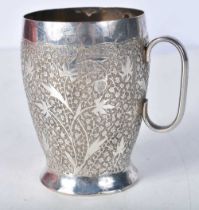 A White Metal Cup with Embossed Floral decoration. 8.3cm x 8.4cm x 6.4cm, weight 121g