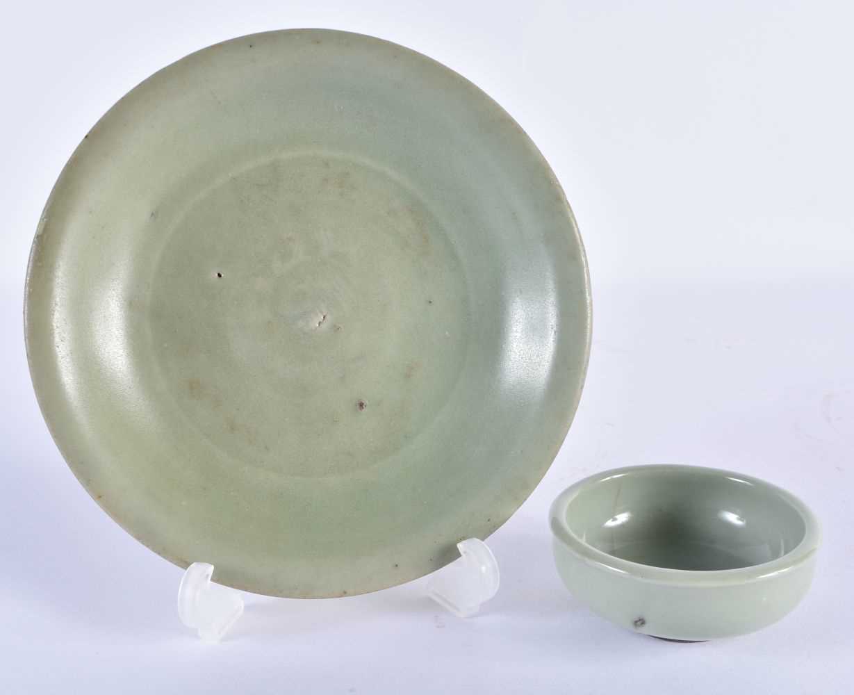 A CHINESE MING DYNASTY CELADON CIRCULAR DISH together with a Qing dynasty guan type bowl. Largest 14