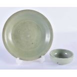A CHINESE MING DYNASTY CELADON CIRCULAR DISH together with a Qing dynasty guan type bowl. Largest 14