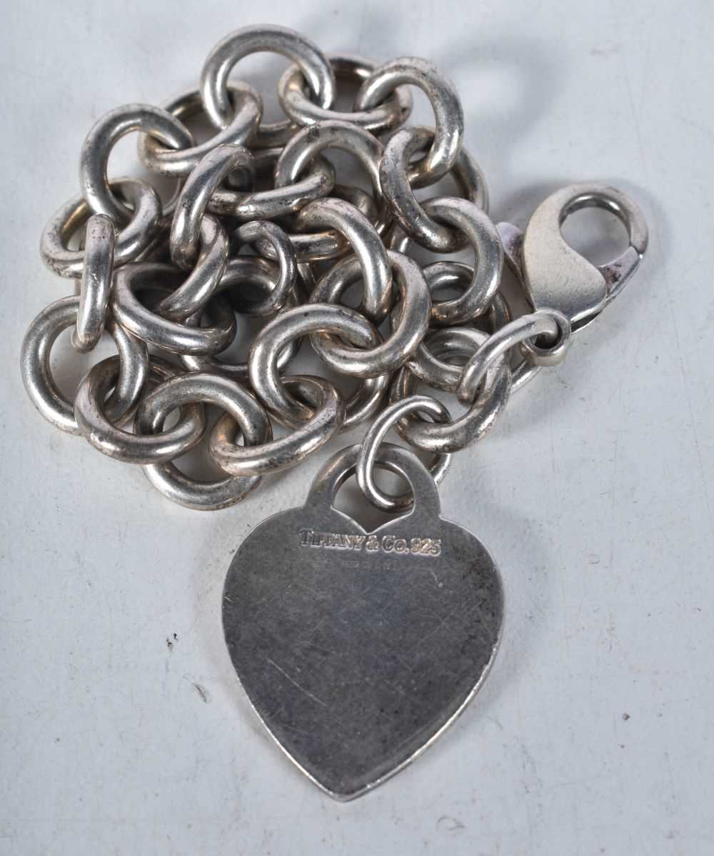 Silver bracelet with heart tag by designer Tiffany & Co. Stamped Tiffany 925. 19cm long, weight 35g