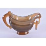 A 19TH CENTURY CHINESE CARVED AGATE LIBATION CUP Qing, of plain form with ring handle. 7.5 cm x 5