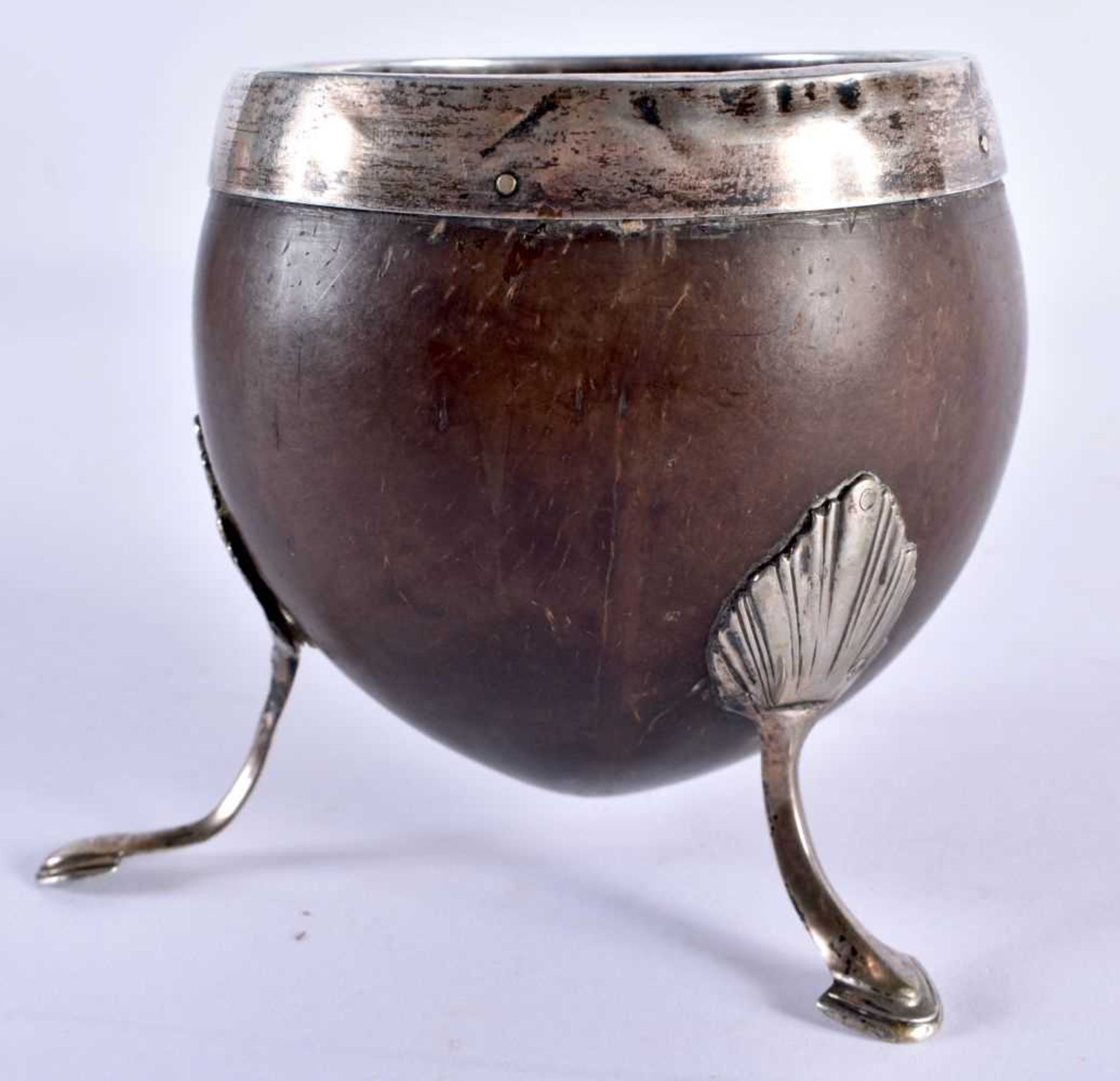 A GEORGE III WHITE METAL MOUNTED COCONUT CUP formed with a scrolling cartouche, upon splayed legs. - Image 3 of 5