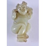 A 19TH CENTURY CHINESE CARVED GREEN JADE FIGURE OF A DANCING BOY Qing, modelled with a cat upon