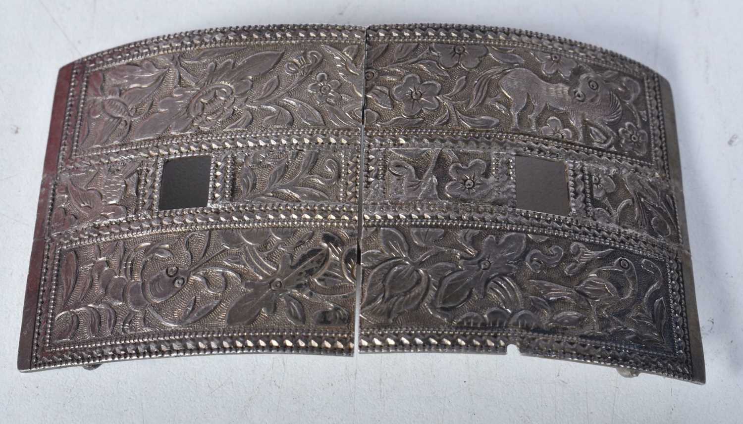 A Middle Eastern Belt Buckle decorated with Birds and Animals. 5.1cm x 9.6cm, weight 60g