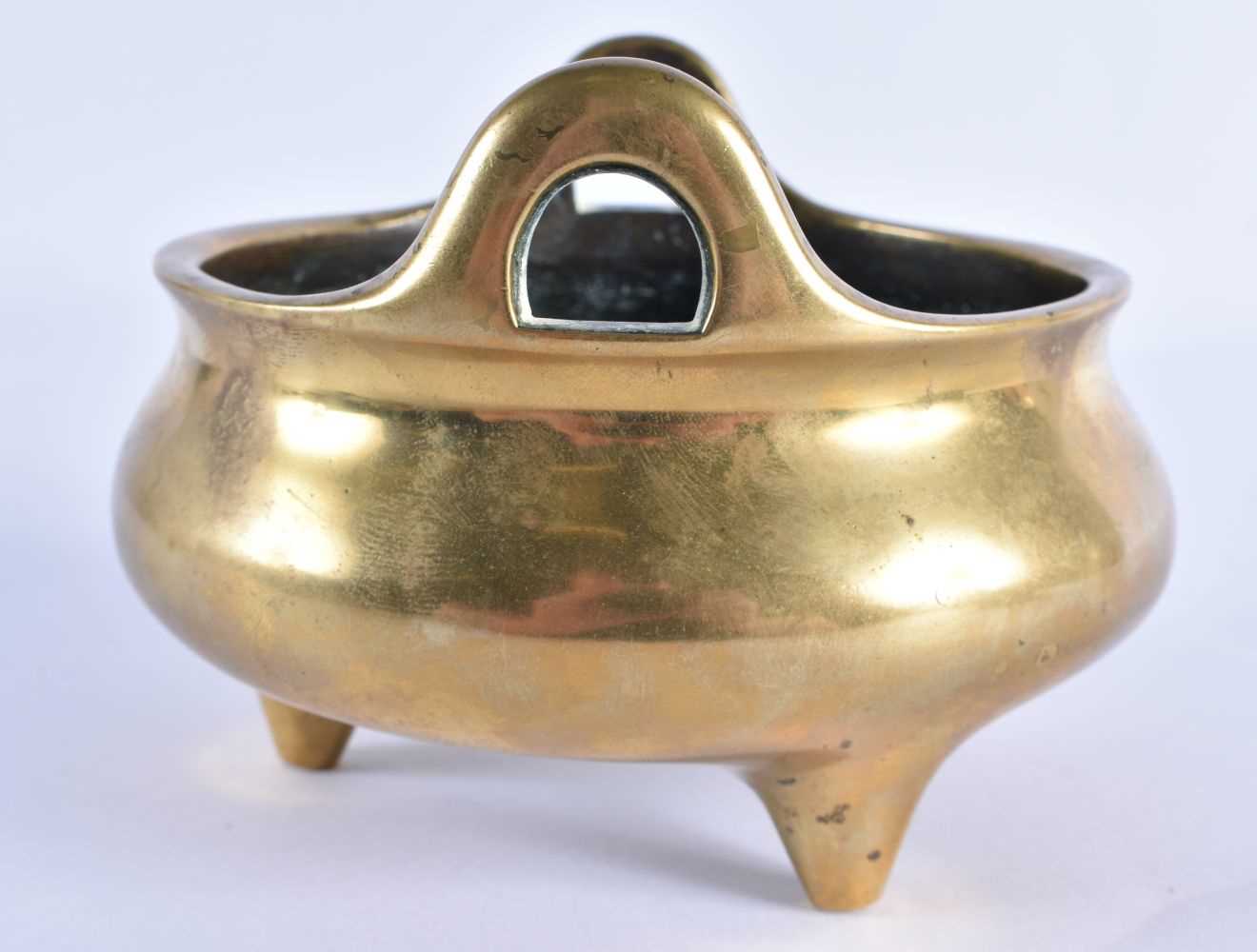 AN 18TH CENTURY CHINESE TWIN HANDLED BRONZE CENSER with high loop handles, bearing Xuande marks to - Image 2 of 7