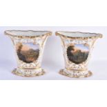 A PAIR OF EARLY 19TH CENTURY EUROPEAN PORCELAIN VASES finely painted with building within