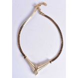 Gold tone enamel necklace by designer Christian Dior . 37 grams. 47 cm long.