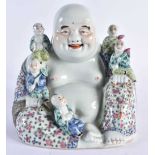 AN EARLY 20TH CENTURY CHINESE FAMILLE ROSE PORCELAIN FIGURE OF A BUDDHA Late Qing/Republic, modelled