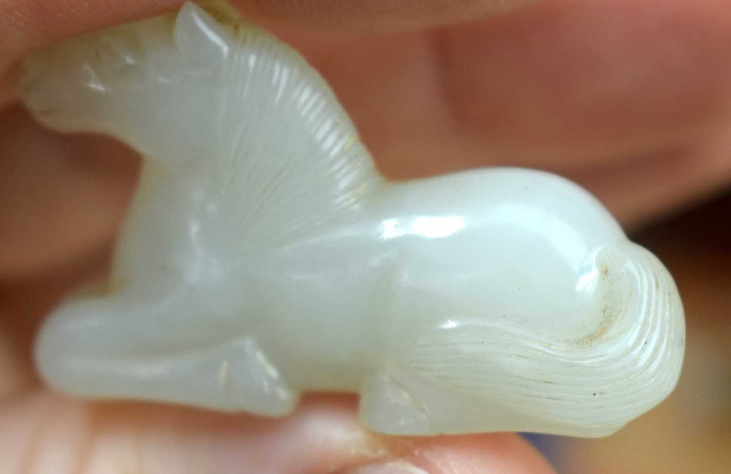 A 19TH CENTURY CHINESE CARVED WHITE JADE FIGURE OF A RECUMBANT HORSE Qing. 3 cm x 2 cm. - Image 5 of 12