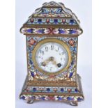 A 19TH CENTURY FRENCH CHAMPLEVE ENAMEL MANTEL CLOCK decorated with foliage and vines. 22 cm x 11