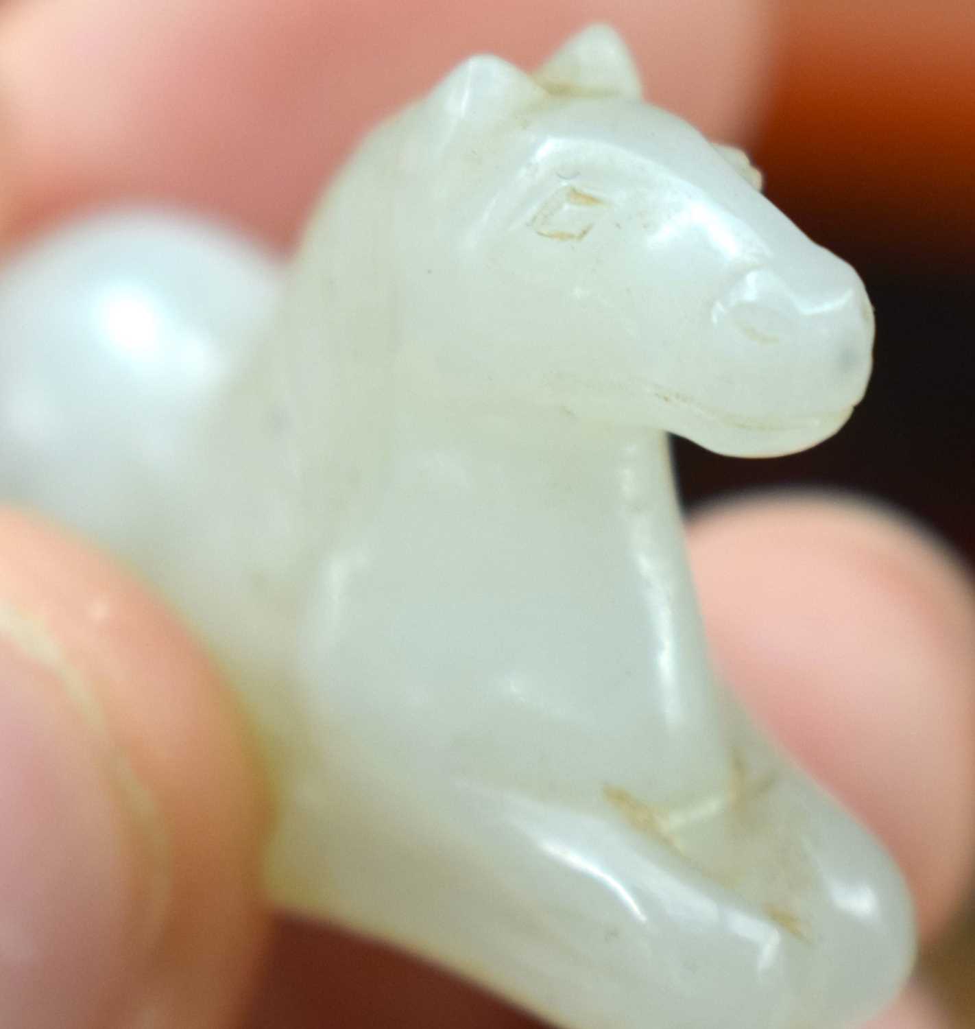 A 19TH CENTURY CHINESE CARVED WHITE JADE FIGURE OF A RECUMBANT HORSE Qing. 3 cm x 2 cm. - Image 8 of 12