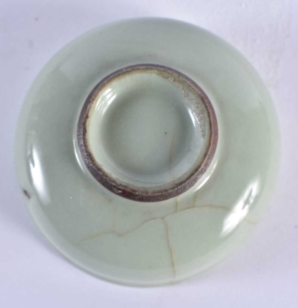 A CHINESE MING DYNASTY CELADON CIRCULAR DISH together with a Qing dynasty guan type bowl. Largest 14 - Image 7 of 7