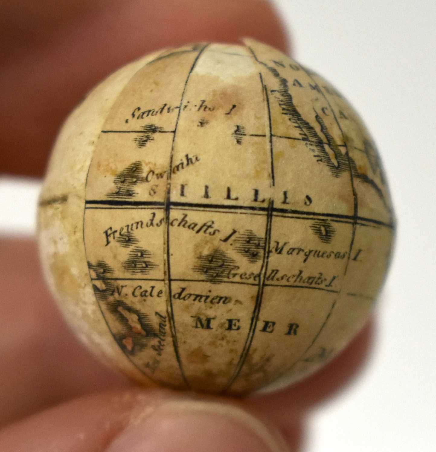 AN EXTREMELY RARE ANTIQUE CARVED NUT GLOBE the body rotating to reveal a tiny pocket globe. Nut 6 cm - Image 19 of 20