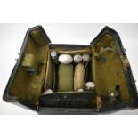 AN ANTIQUE CASED LEATHER AND SILVER TRAVELLING CASE with partially fitted interior. London 1910 etc.