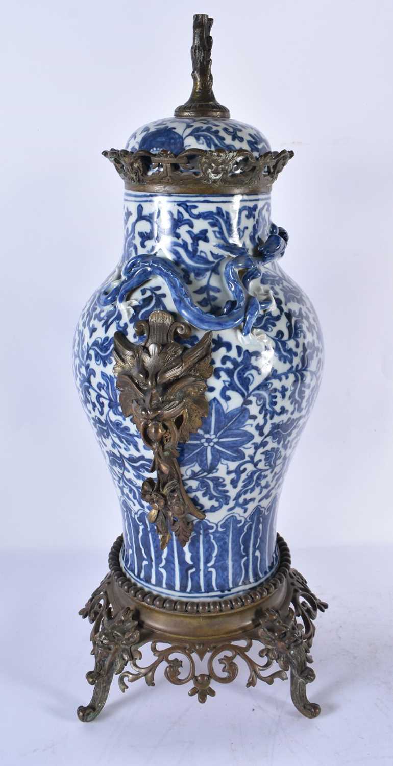 A LARGE PAIR OF 19TH CENTURY CHINESE BLUE AND WHITE BRONZE MOUNTED VASES Qing. 48 cm high. - Image 5 of 24