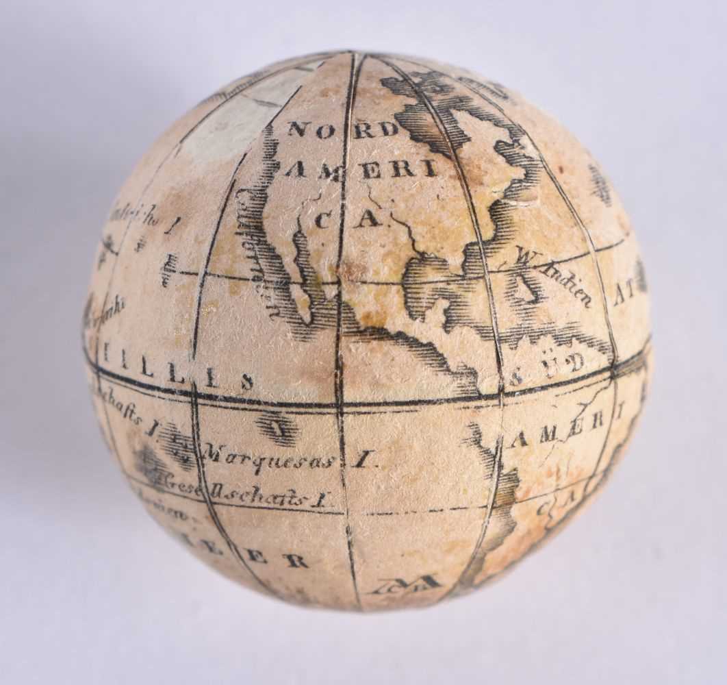 AN EXTREMELY RARE ANTIQUE CARVED NUT GLOBE the body rotating to reveal a tiny pocket globe. Nut 6 cm - Image 4 of 20
