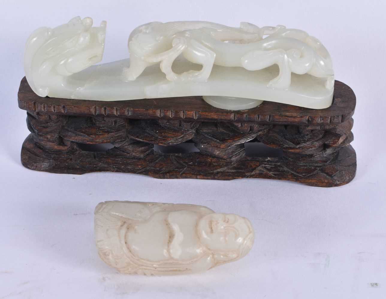 AN 18TH/19TH CENTURY CHINESE GREENISH JADE BELT HOOK Qing, together with another jade. Largest