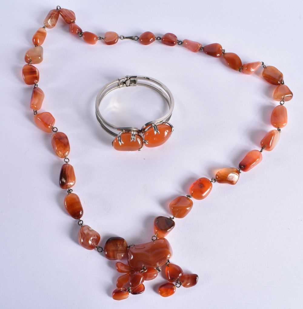 An Agate Necklace together with an Agate Bangle. Necklace 74cm long, total weight 165g. (2)