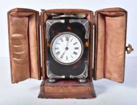 A Tortoiseshell Cased Carriage Alarm Clock with Silver Mounts in a fitted leather travelling