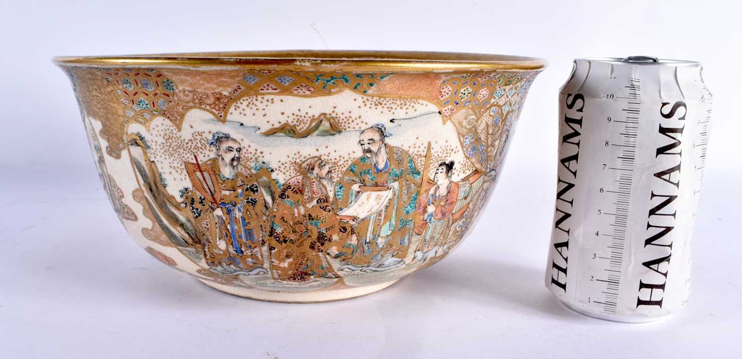 A LARGE 19TH CENTURY JAPANESE MEIJI PERIOD SATSUMA BOWL painted with immortals within landscapes,