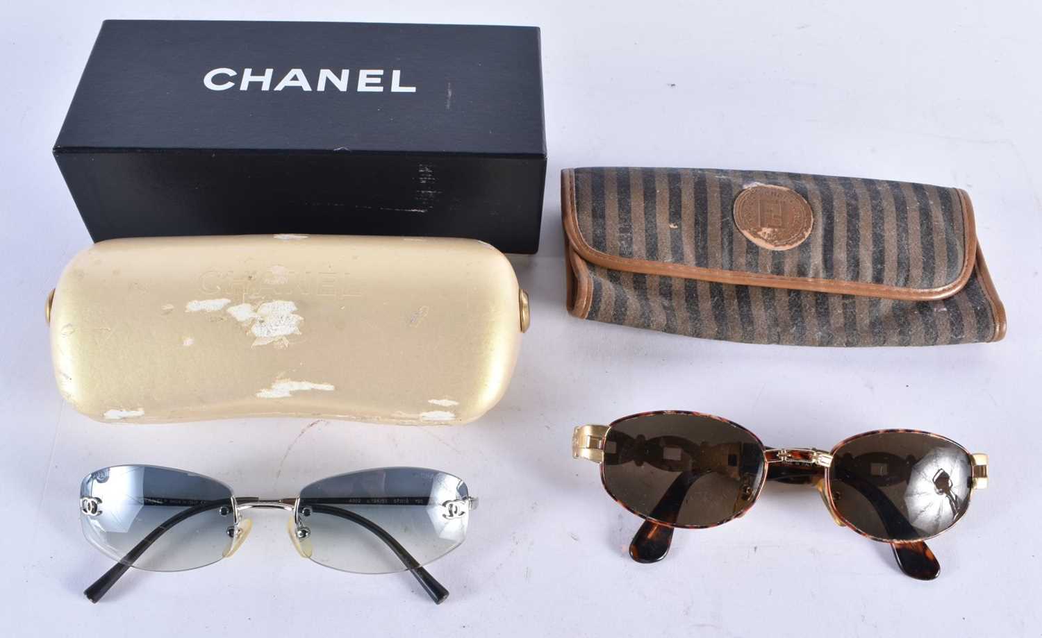 TWO PAIRS OF SUNGLASSES Fendi & Chanel. 15 cm wide. (2)