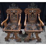 A pair of 19th Century Walnut Italian Chairs in the style of Adriano Brambilla lavishly inlaid