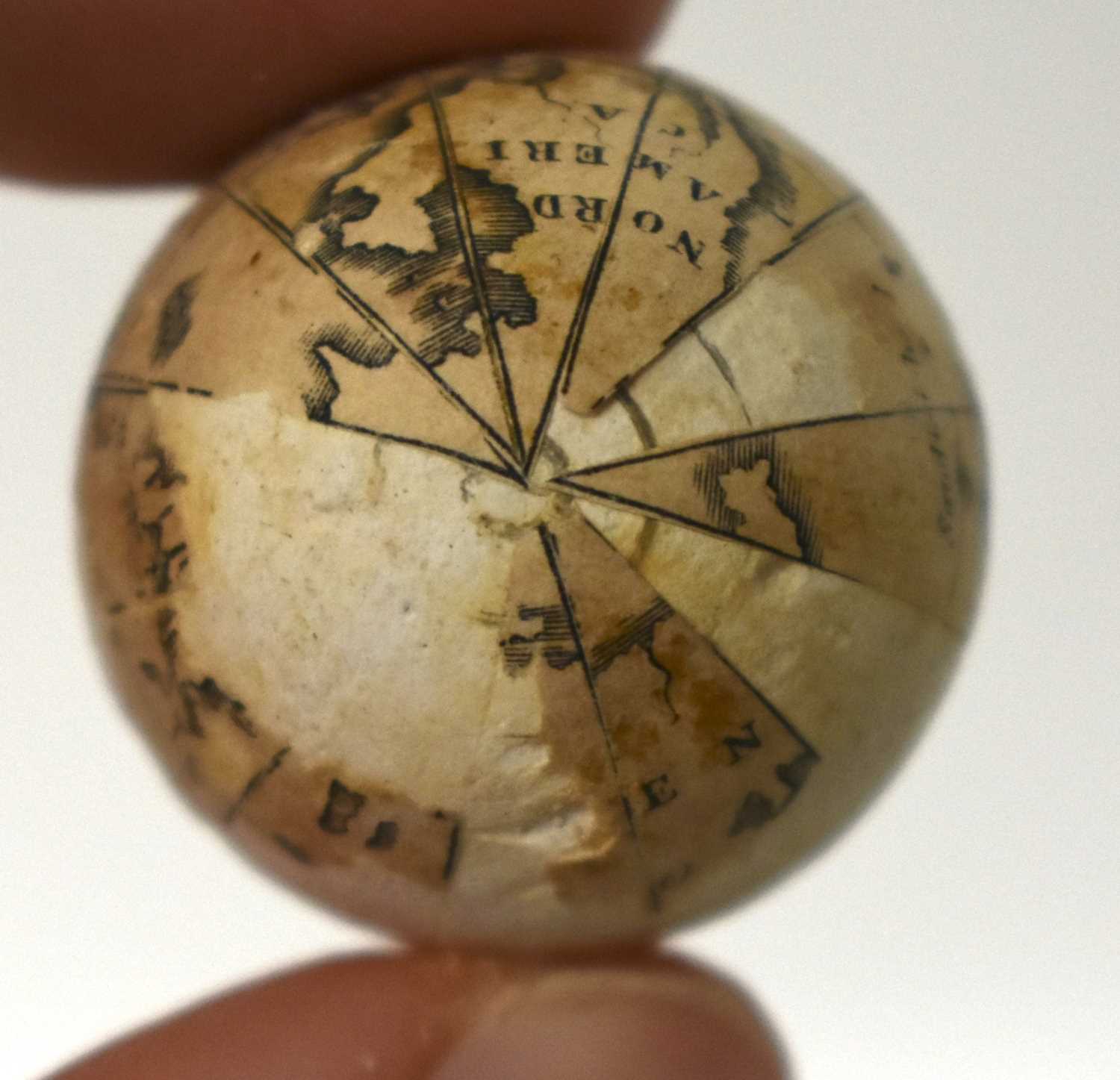 AN EXTREMELY RARE ANTIQUE CARVED NUT GLOBE the body rotating to reveal a tiny pocket globe. Nut 6 cm - Image 16 of 20