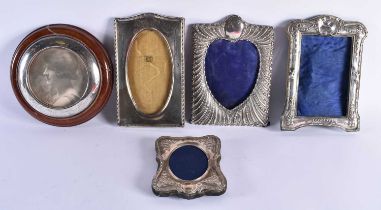 FIVE ANTIQUE SILVER PHOTOGRAPH FRAMES. 799 grams overall. Largest 17.5 cm x 15 cm. (5)