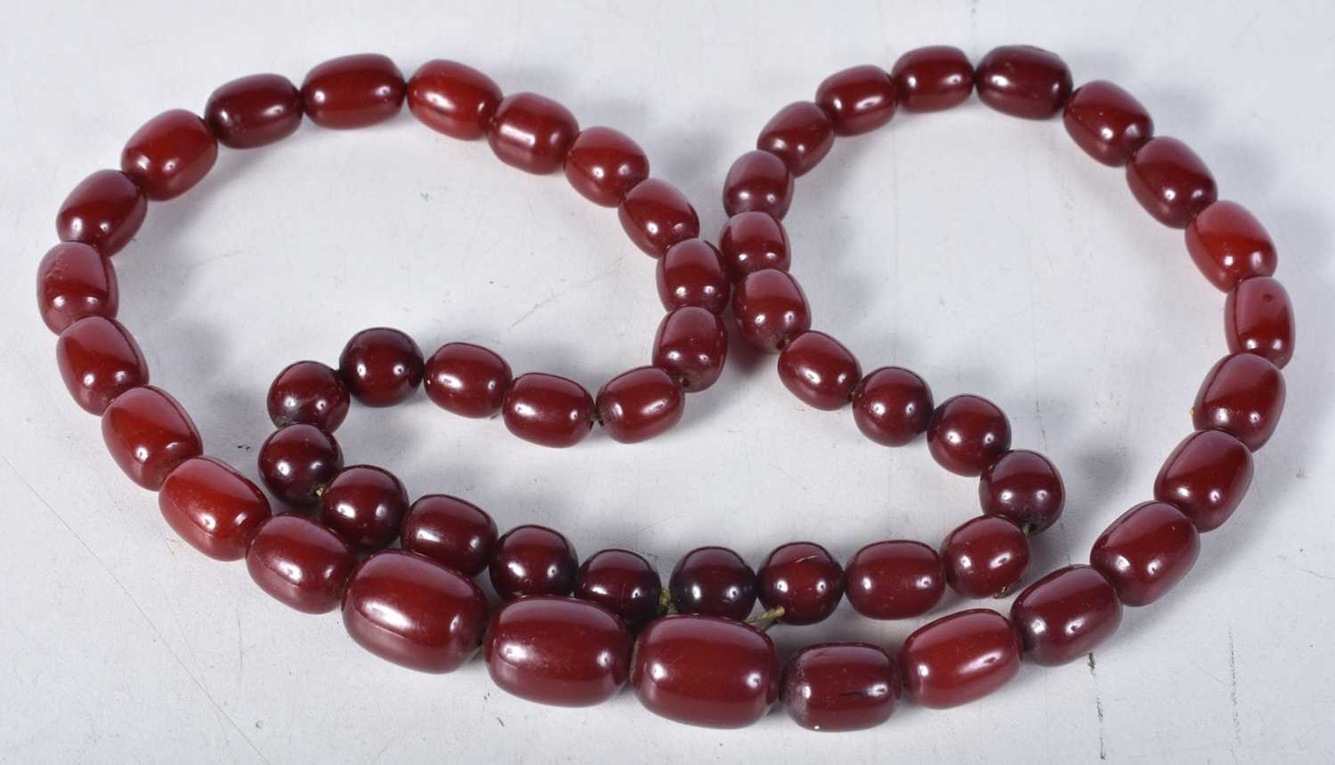 Cherry Bakelite graduated necklace. 83cm long, weight 90g, largest bead 15mm