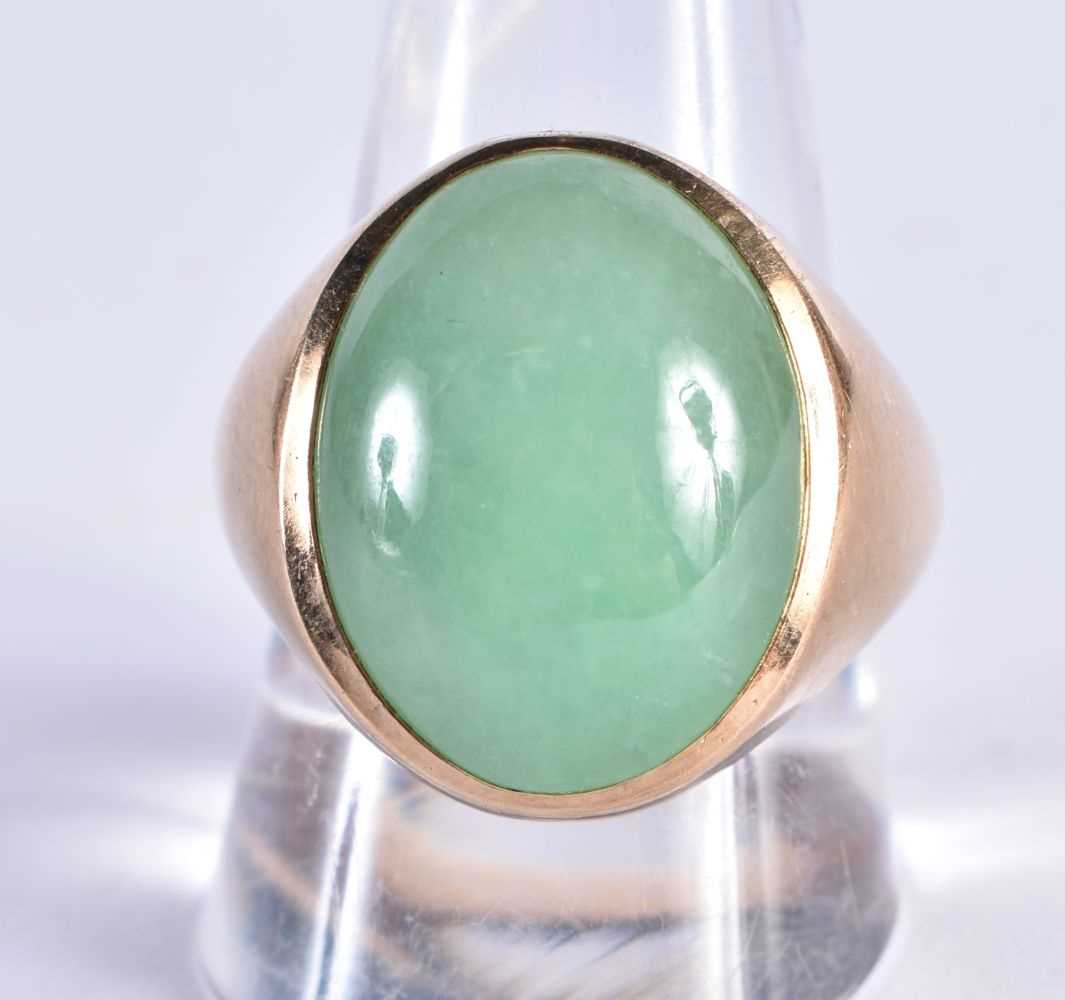 A LARGE CHINESE REPUBLICAN PERIOD 14CT GOLD AND APPLE JADEITE RING. 12 grams.