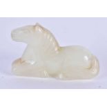 A 19TH CENTURY CHINESE CARVED WHITE JADE FIGURE OF A RECUMBANT HORSE Qing. 3 cm x 2 cm.