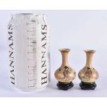 A RARE MINIATURE PAIR OF LATE 19TH CENTURY JAPANESE MEIJI PERIOD SATSUMA VASES painted with