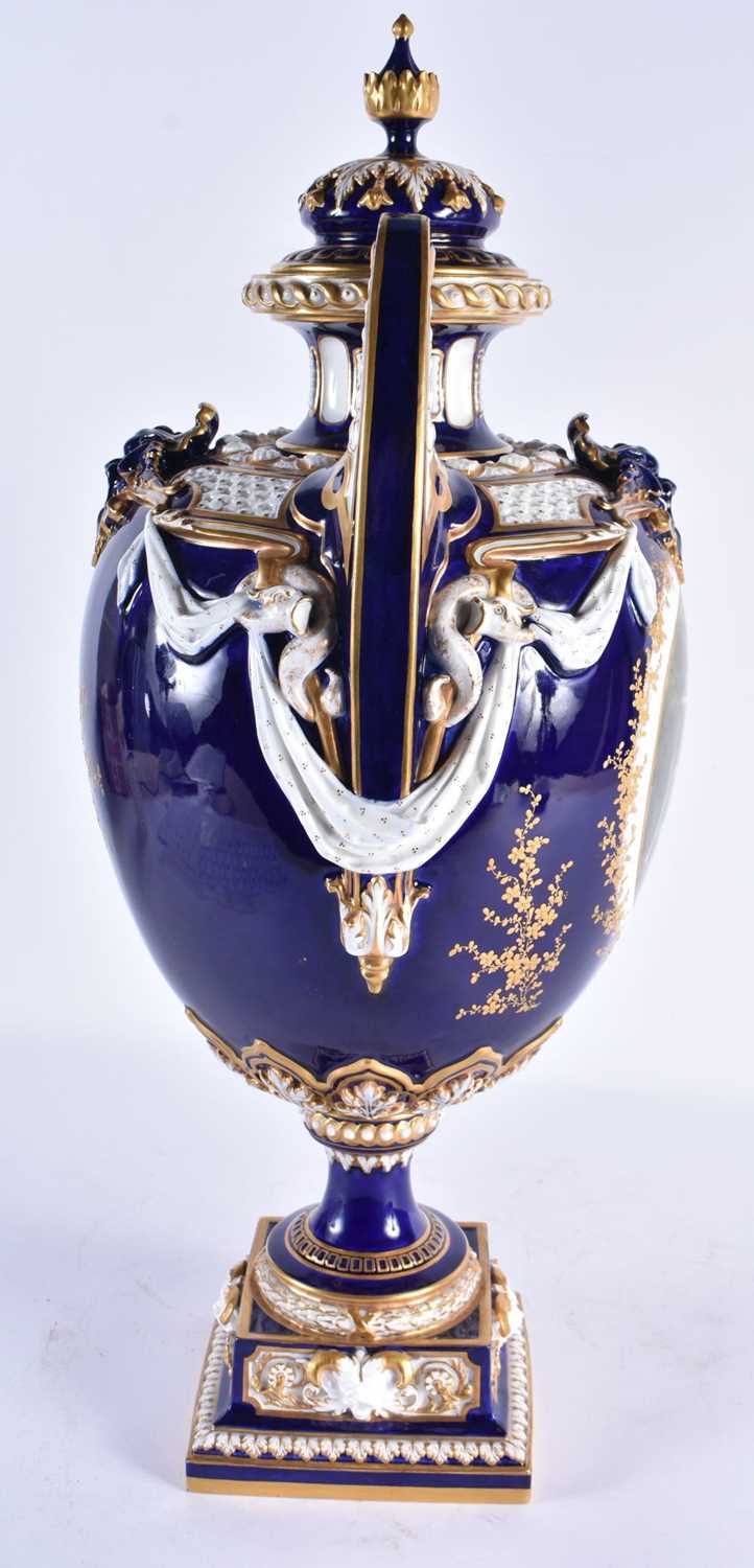 A FINE ROYAL WORCESTER TWIN HANDLED BLUE PORCELAIN VASE AND COVER painted with a landscape by - Image 5 of 9