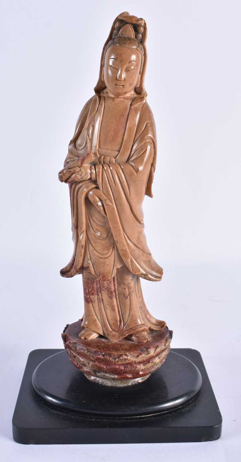 A LATE 18TH/19TH CENTURY CHINESE CARVED SOAPSTONE FIGURE OF AN IMMORTAL Late Qianlong/Jiaqing. 23.