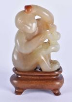 A LOVELY 19TH CENTURY CHINESE CARVED JADE FIGURE OF A MONKEY Qing, modelled with a smaller monkey. 7