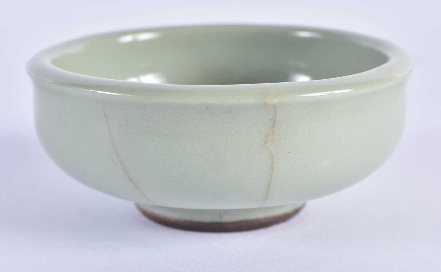 A CHINESE MING DYNASTY CELADON CIRCULAR DISH together with a Qing dynasty guan type bowl. Largest 14 - Image 4 of 7