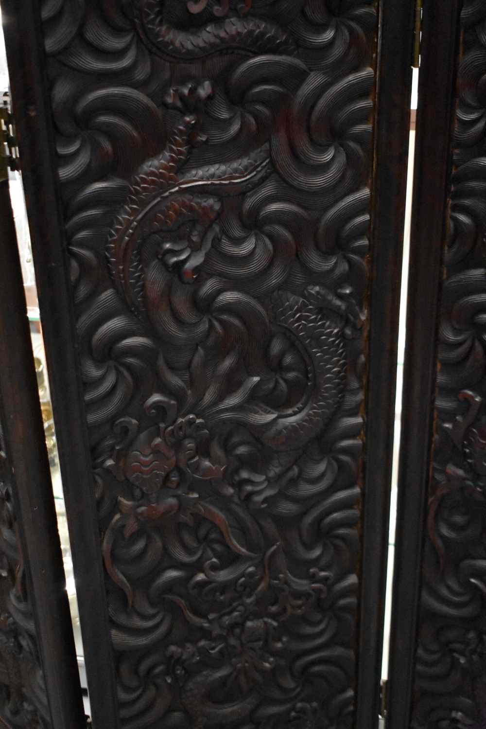 A LARGE 19TH CENTURY CHINESE CARVED HARDWOOD FOUR FOLD DRAGON SCREEN Qing. 142 cm x 136 cm. - Image 9 of 13