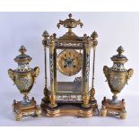 A LARGE LATE 19TH CENTURY FRENCH BRONZE AND CHAMPLEVE ENAMEL CLOCK GARNITURE decorated with foliage.