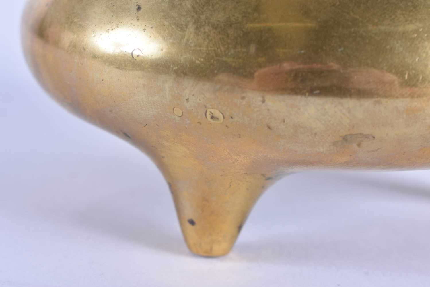 AN 18TH CENTURY CHINESE TWIN HANDLED BRONZE CENSER with high loop handles, bearing Xuande marks to - Image 3 of 7