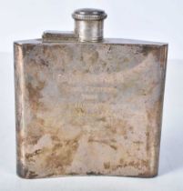 A Silver Hip Flask with Engine Turned dec oration on from and Inscription on back. 11cm x9.6cm x 2.