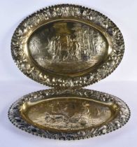 A FINE AND RARE PAIR OF LARGE 18TH CENTURY GEORGE III SILVER GILT REPOUSSE DISHES by Daniel