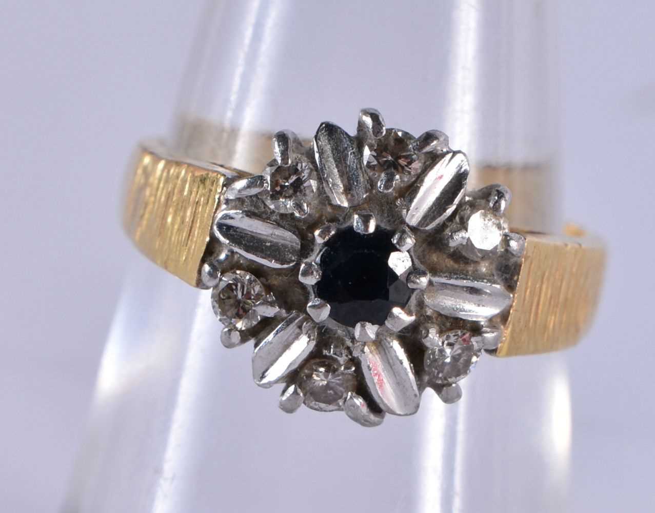 An 18 Carat Gold, Diamond and Sapphire Cluster Ring. Stamped 18CT, Size N, weight 6.2g