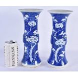A PAIR OF 19TH CENTURY CHINESE BLUE AND WHITE PORCELAIN GU FORM VASES Kangxi style. 25 cm high.