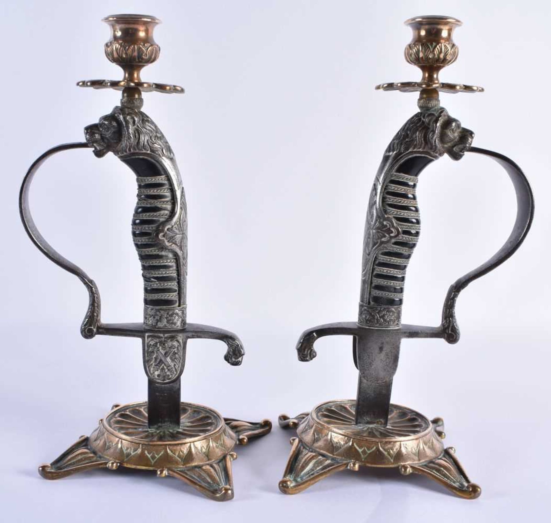 A LOVELY PAIR OF 19TH CENTURY ENGLISH COUNTRY HOUSE MILITARY INTEREST CANDLESTICKS formed as steel
