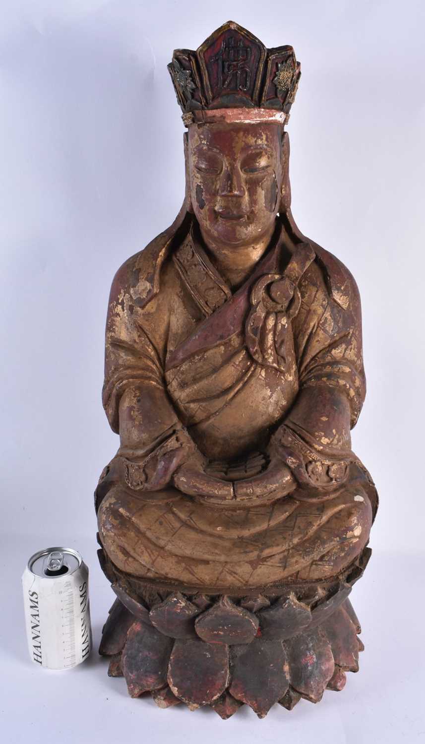 A VERY LARGE 17TH CENTURY CHINESE POLYCHROMED LACQUERED WOOD FIGURE OF A SEATED BUDDHA Late Ming,