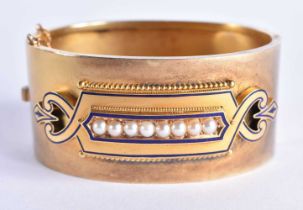 A Victorian Antique Gold (probably 15 Carat) Mourning Bangle set with Enamel and Pearl decoration.