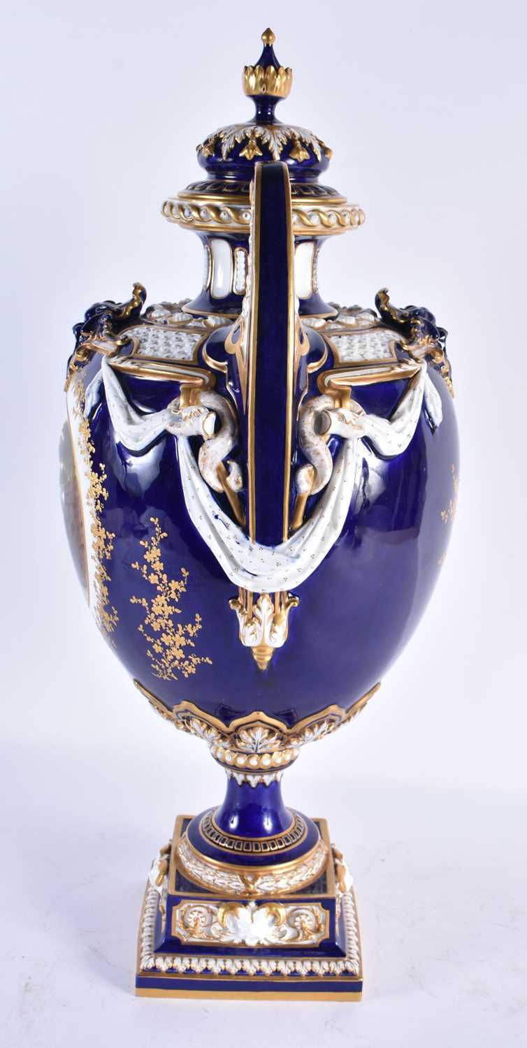 A FINE ROYAL WORCESTER TWIN HANDLED BLUE PORCELAIN VASE AND COVER painted with a landscape by - Image 3 of 9