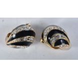 Pair of gold tone clip on earrings by designer Nina Ricci. Stamped Nina Ricci. 2.1cm x 1.6cm, weight