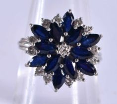 An 18 Carat White Gold, Diamond and Sapphire Cluster Ring. Stamped 750, Size P, weight 6.76g