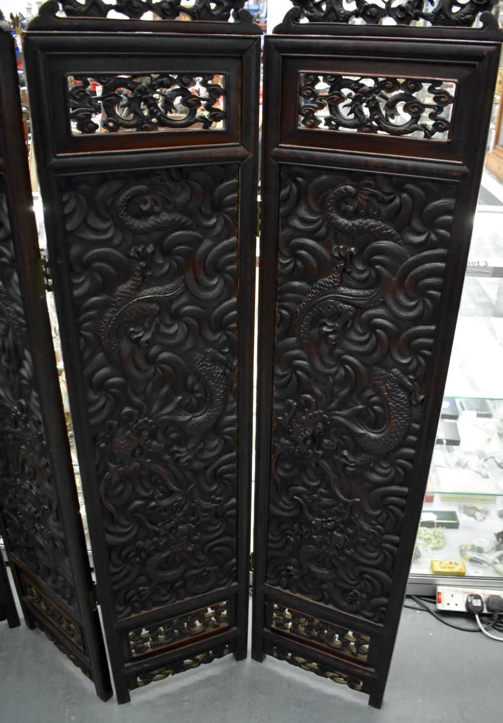 A LARGE 19TH CENTURY CHINESE CARVED HARDWOOD FOUR FOLD DRAGON SCREEN Qing. 142 cm x 136 cm. - Image 8 of 13